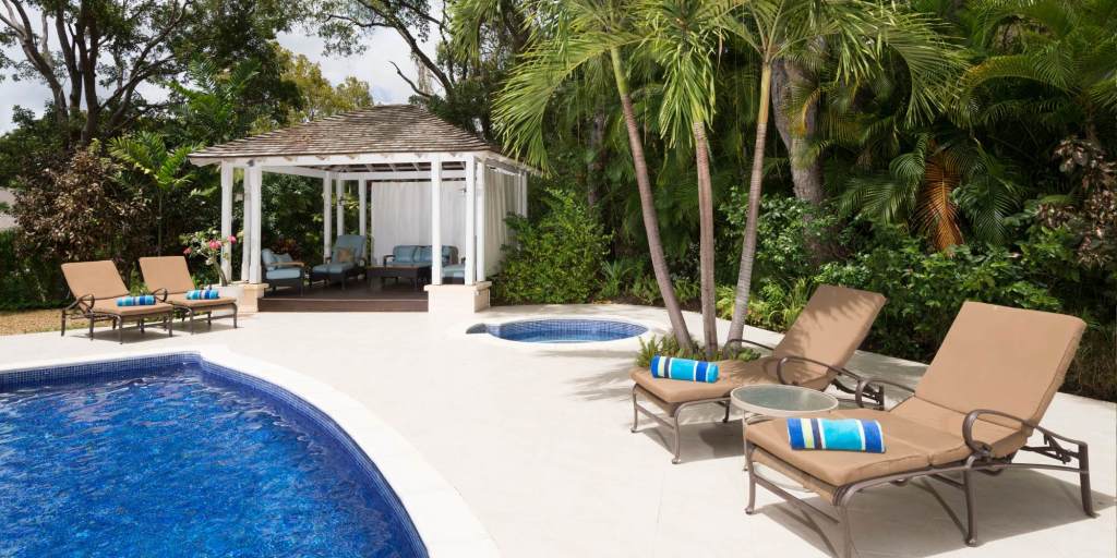 Lounge chairs and gazebo by a pool